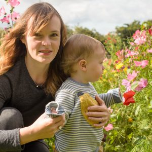 Jonah and mummy crouching in the flowers
