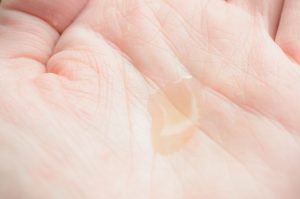 Weleda nursing oil in the palm of my hand