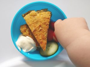 Jonah tucking in to cheese and lentil wedges