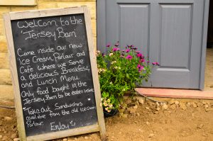 The smell of hot food is wafting out the café door