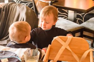 Jonah making friends wearing his bib