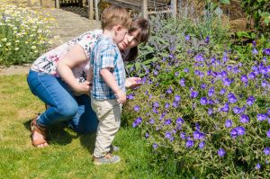 Mummy and Jonah looking at flowers together