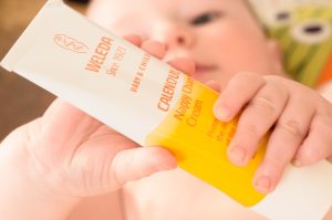 Jonah plays with Weleda Calendula Nappy Change Cream