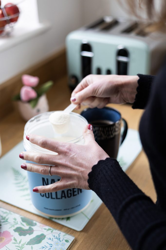 Scooping Naked Collagen from the tub